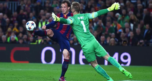  Ivan Rakitic of Barcelona lifts the ball over Manchester City goalkeeper Joe Hart  to score the opening goal in  the Champions League Round of 16 second-leg match  at the Nou Camp. Photograph:  Michael Regan/Getty Images