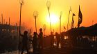  Indian fishermen silhuetted by the rising sun as they prepare for an early morning catch at the banks of Narmada river in Nemawar district Dewas, 200km from Bhopal, Madhya Pradesh, India. Photograph: EPA/SAJNEEV GUPTA