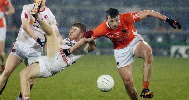 Tyrone’s Cathal McShane grapples with Armagh’s Ethan Rafferty. Photograph: Inpho