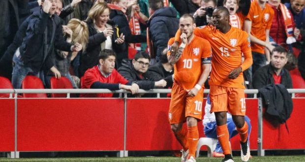 Wesley Sneijder does a “baby celebration” with Jetro Willems after Klaas-Jan Huntelaar’s late equaliser for the Netherlands against Turkey in the Euro 2016 qualifier in Amsterdam last week. Photograph: Epa.