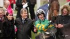 Nina Carberry and On The Fringe celebrate their victory in the   The Foxhunter  Chase at Cheltenham with owner JP McManus. Photograph:  Dan Sheridan/Inpho