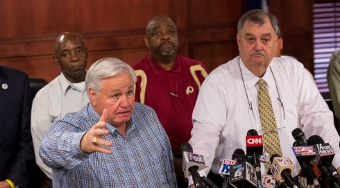 North Charleston Mayor Keith Summey answers questions during a press conference as Police Chief Eddie Driggers looks on. Photograph: Richard Ellis/Getty Images
