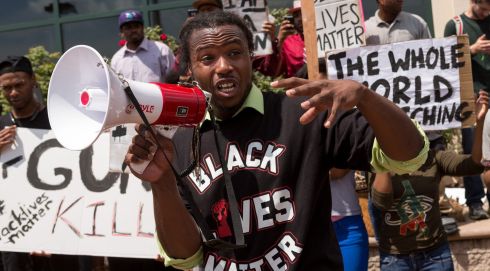 People participate in a rally to protest the death of Walter Scott. Photograph: Richard Ellis/Getty Images
