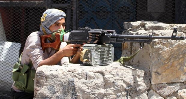 A Yemeni tribal gunman of the Popular Resistance Committees loyal to president Abedrabbo Mansour Hadi monitors a street  on Thursday as al-Qaeda militants seized a  airport in Yemen. Photograph: Taha Salehtaha Saleh/AFP/Getty Images