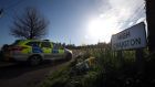 Police activity and floral tributes at High Craigton Farm. The news on Wednesday afternoon that police had cordoned off the farm some 13km north of Glasgow suggested that the investigation team had received important intelligence: Photograph: Andrew Milligan/PA Wire