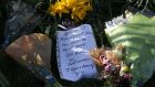 Floral tributes at High Craigton Farm, outside Glasgow. Photograph: Andrew Milligan/PA 