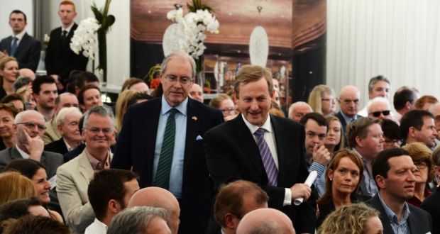 US ambassador to Ireland Kevin O’Malley (standing, centre  left) with Taoiseach  Enda Kenny at an  economic conference at the US ambassador’s residence in recent days. Photograph: Cyril Byrne/The Irish Times