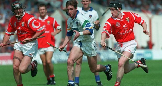 Waterford’s Tony Browne is pursued by Brian Corcoran and Pat Ryan of Cork during the 1998 National Hurling League Final. Photograph: Patrick Bolger/Inpho.