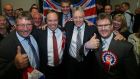 DUP Leader Peter Robinson celebrates with MPs (left to right) Sammy Wilson, Nigel Dodds, Gavin Robinson and Jeffrey Donaldson their General Election results at the Kings Hall in Belfast. Photograph: Niall Carson/PA Wire 