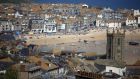 St Ives harbour, Cornwall:   this part of England  gets the best weather, yet doesn’t get too hot for children. Photograph: Matt  Cardy/Getty Images