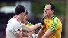Tyrone’s Ronan McNabb gets to grips with Donegal’s Michael Murphy during their Ulster clash last Sunday. 