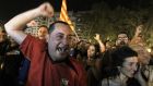 People celebrate the results of leftist parties at the townhall square after the Spanish regional and local elections in Valencia, Spain