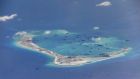 Chinese dredging vessels are purportedly seen in the waters around Mischief Reef in the disputed Spratly Islands in the South China Sea. Photograph: Reuters/US Navy