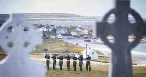 A volley of shots are fired during the at the commemoration ceremony on Friday on Inis Óirr for Private Caomhán Seoighe. Photograph:  Eamon Ward.