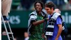  Gael Monfils of France and Roger Federerreact after their fourth round match was interrupted and postponed for the next day at the French Open tennis tournament at Roland Garros. Photo: EPA