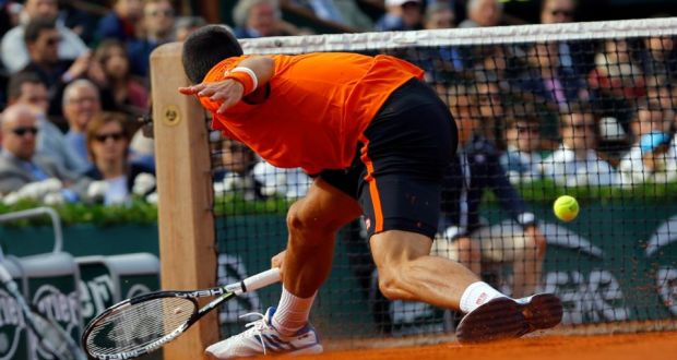  Novak Djokovic of Serbia in action against Richard Gasquet of France during their fourth round match for the French Open tennis tournament at Roland Garros in Paris. Photo: EPA
