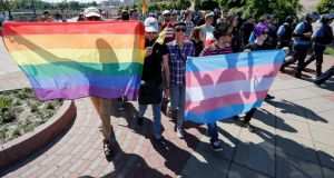 Participants carry flags during the Gay Pride parade in Kiev, Ukraine. Photograph: Roman Pilipey/EPA.