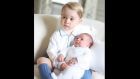 Britain’s Princess Charlotte is held by her brother Prince George in a photograph taken by their mother the Duchess of Cambridge in mid-May at Anmer Hall in Norfolk. Photograph: Duchess of Cambridge via PA Wire. 