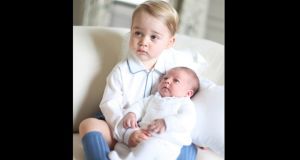 Britain’s Princess Charlotte is held by her brother Prince George in a photograph taken by their mother the Duchess of Cambridge in mid-May at Anmer Hall in Norfolk. Photograph: Duchess of Cambridge via PA Wire. 