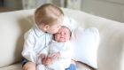 Britain’s Princess Charlotte is kissed by her  brother Prince George in a photograph taken by their mother the Duchess of Cambridge in mid-May at Anmer Hall in Norfolk. Photograph:  Duchess of Cambridge via PA Wire.
