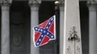 The Confederate flag flies on the Capitol grounds after South Carolina Governor Nikki Haley announced that she will call for the Confederate flag to be removed  in Columbia, South Carolina. Photograph:  Joe Raedle/Getty Images