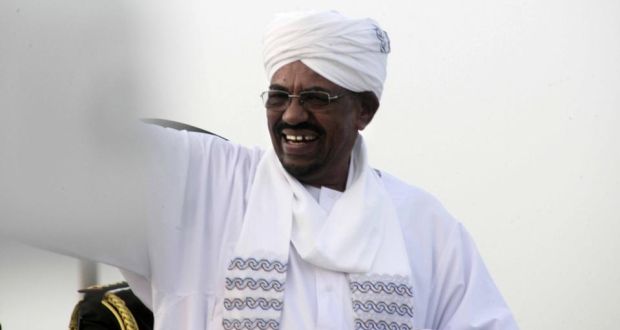 Sudanese president Omar al-Bashir waves as he arrives in Khartoum from Johannesburg after a court ordered him not to leave South Africa as it decided whether to arrest him over alleged war crimes.  Photograph: Ebrahim Hamid/AFP/Getty Images