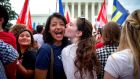  Pooja Mandagere (left) and Natalie Thompson celebrate  outside the US Supreme Court following the announcement of the ruling  that the constitution guarantees a nationwide right to same-sex marriage.  Photograph: Doug Mills/the New York Times