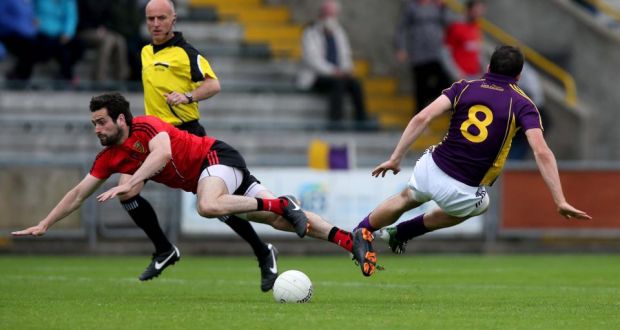 Down’s Kevin McKernan collides with   Syl Byrne of Wexford during the  All-Ireland SFC Round 1B Qualifier at  Wexford Park. Photograph: Donall Farmer/Inpho