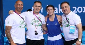 Katie Taylor celebrates her gold medal win in the European Games in Baku with her coaches Pete Taylor, Zaur Anita and Billy Walsh. Photograph: Ryan Byrne/INPHO