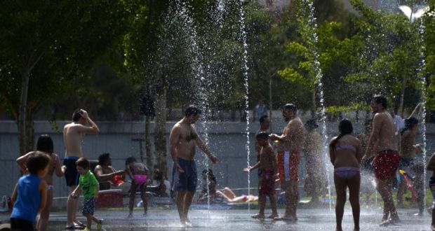 People cool off in a fountain of a park in Madrid as a major heatwave spreads up through Europe, with temperatures hitting nearly 40 degrees. Photograph: Gerard Julien/AFP/Getty Images