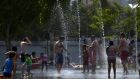 People cool off in a fountain of a park in Madrid as a major heatwave spreads up through Europe, with temperatures hitting nearly 40 degrees. Photograph: Gerard Julien/AFP/Getty Images