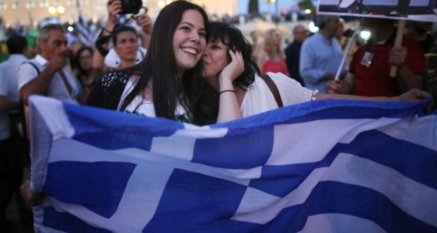  People celebrate in front of the Greek parliament as early polls predict a win for the Oxi, or No, campaign in the Greek austerity referendum. Photograph: Getty
