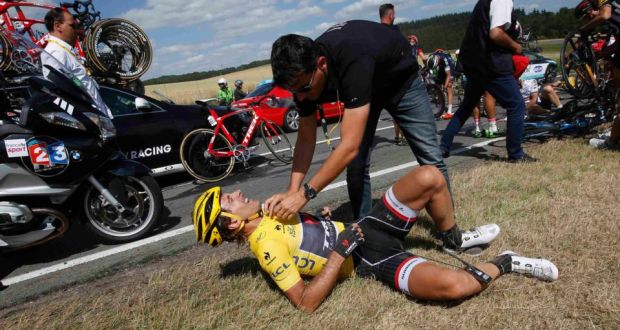 Trek Factory rider Fabian Cancellara of Switzerland receives assistance after a fall during the 159,5km third stage of the Tour de France from Anvers to Huy, Belgium. Photograph: Reuters