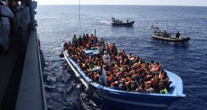 Handout photo issued by Irish Defence Forces of the operation by members of the Irish Navy vessel LÉ Eithne as they rescue refugees  in the Mediterranean. Photograph: David Jones/Irish Defence Forces/PA Wire