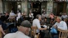 Athenians enjoy their coffee at a cafe, two days after the referendum. Photograph:  Yannis Kolesidis/EPA