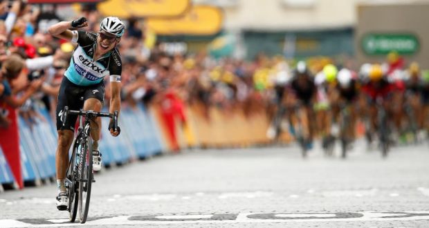 Etixx Quick Step team rider Tony Martin of Germany celebrates as he crosses the finish line to win the 4th stage of the 102nd edition of the Tour de France 2015 cycling race over 223.5km between Seraing, Belgium and Cambrai, France. Photo: Yoan Valat/PA