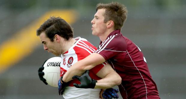 Liam Silke tackles Benny Heron during Galway’s victory over Derry in Salthill. Photograph: Inpho
