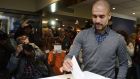 A file picture taken from 2014 shows  Pep Guardiola casting his ballot at a polling station in Barcelona, during a symbolic vote on independence of Catalonia from Spain. Photograph: AFP 