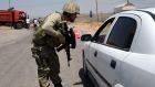 A Turkish soldier check cars at a check point in Diyarbakir on July 26th, 2015 following the death of two Turkish soldiers. Photograph: Inilyas Akengin/AFP/Getty Images