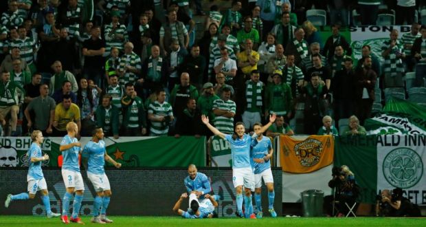 Markus Rosenberg celebrates with team mates after scoring the first goal for Malmo against Celtic. Photograph: Andrew Boyers/Reuters 
