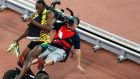 A cameraman riding a segway drives into a celebrating Usain Bolt after the men’s 200m final at the Bird’s Nest in Beijing. Photograph: Rolex De La Pena/EPA 