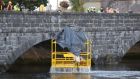 The scene at Thomond Bridge in Limerick on Saturday evening as the cage structure was lifted out of the water. Photograph: Liam Burke/Press 22