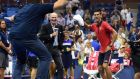 Novak Djokovic  dances on the court with a fan after defeating Andreas Haider-Maurer of Austria during their US Open 2015 second round men’s singles match  in New York. Photo: Don Emmert/Getty Images