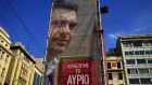 A banner of Alexis Tsipras hangs over Syriza’s pre-election kiosk in Athens. The banner reads: ‘We are winning tomorrow’. Photograph: Reuters