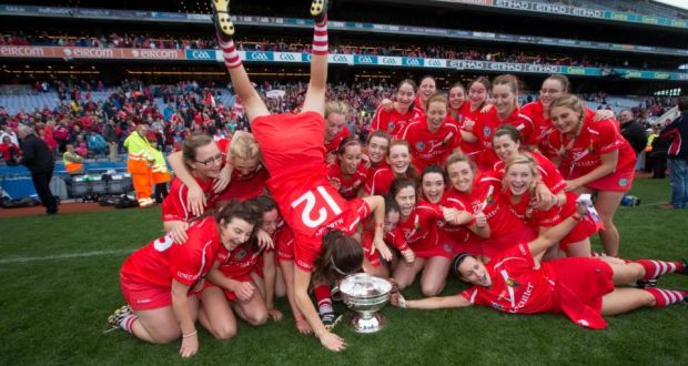 Head over heels: Cork celebrate with the O’Duffy Cup following their win over Galway at Croke Park. Photograph: Ryan Byrne/Inpho