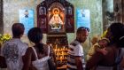 Cubans attend a Catholic service in Havana. Photograph: Daniel Berehulak/The New York Times