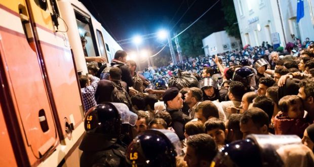 Refugees trying to board a train at the border between Serbia and Croatia near the city of Tovarnik, Croatia, on  September 17th. Photograph: EPA/GREGOR FISCHER