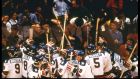 The United States  celebrate their 4-3 victory over Russia in Lake Placid. 