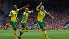 Russell Martin celebrates after  scoring  Norwich’s equaliser in the premier league game against Liverpool at Anfield. Photograph:   Phil Noble/Reuters/Livepic