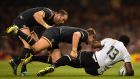 Fiji’s centre Vereniki Goneva  is tackled by Dan Biggar  and   Jamie Roberts of Wales  during the Rugby World Cup  Pool A match at the Millennium stadium in Cardiff. Photograph: Gabriel Bouys/AFP/Getty Images